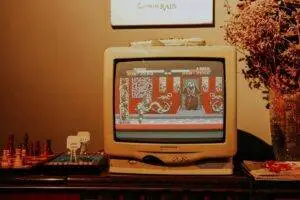 Retro living room scene featuring vintage TV playing classic video game.